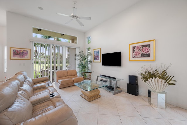 living room with ceiling fan, high vaulted ceiling, and light tile patterned floors