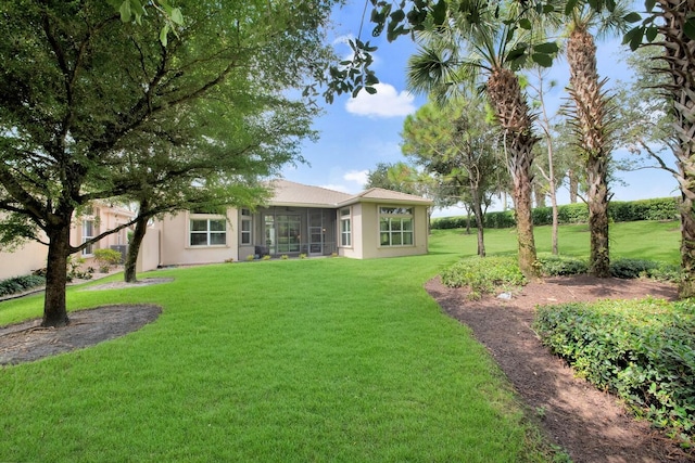 view of yard featuring a sunroom