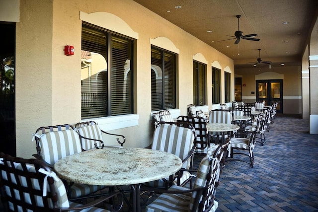 view of patio / terrace with french doors and ceiling fan