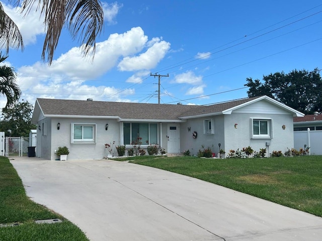 ranch-style home with a front lawn