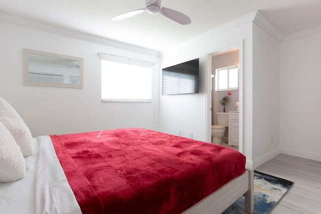 bedroom featuring ornamental molding, a textured ceiling, wood-type flooring, ceiling fan, and ensuite bathroom