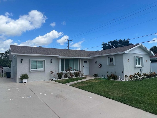 ranch-style house with a front lawn