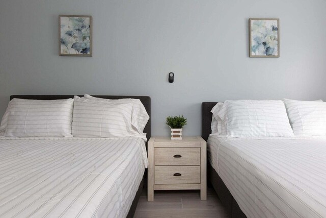 bedroom with wood-type flooring