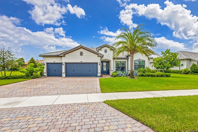 view of front facade with a front lawn and a garage