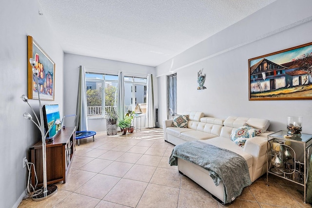 living room with light tile patterned flooring and a textured ceiling