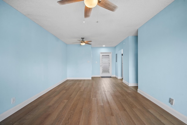 spare room featuring a textured ceiling, hardwood / wood-style floors, and ceiling fan