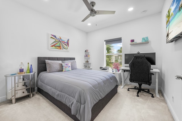 bedroom featuring light carpet and ceiling fan