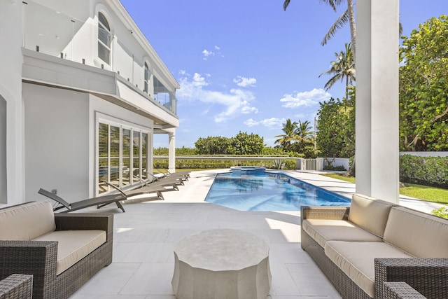 view of pool featuring an outdoor hangout area, a patio, and a fenced in pool