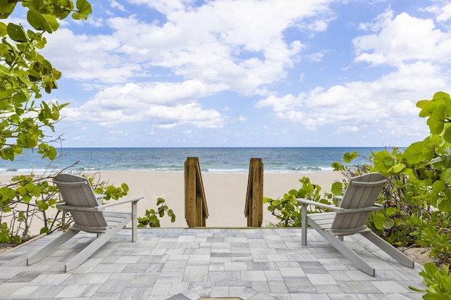 property view of water featuring a beach view