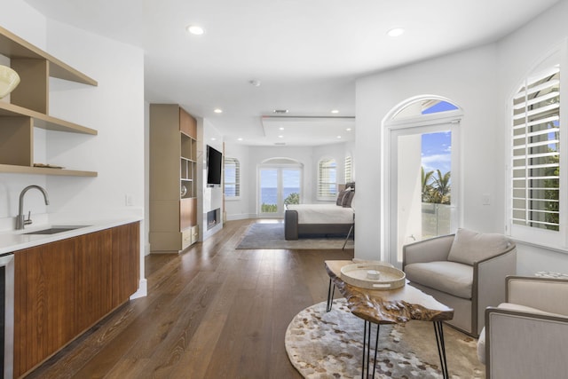 interior space featuring baseboards, dark wood-type flooring, and recessed lighting