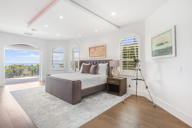 bedroom featuring hardwood / wood-style floors and access to exterior