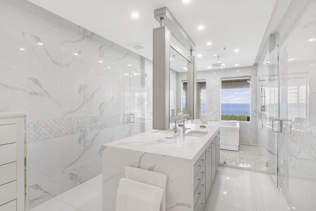 bathroom featuring tile walls, vanity, an enclosed shower, and tile patterned floors