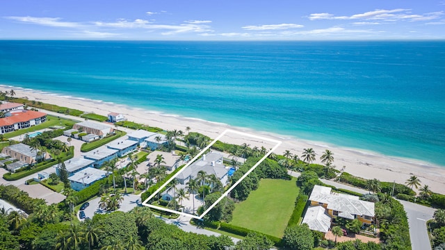 drone / aerial view with a water view and a view of the beach