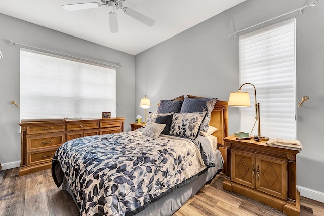 bedroom featuring dark wood-type flooring and ceiling fan