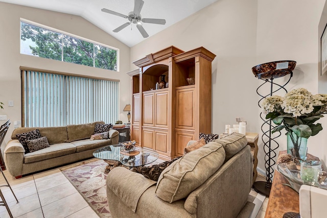 tiled living room with lofted ceiling and ceiling fan