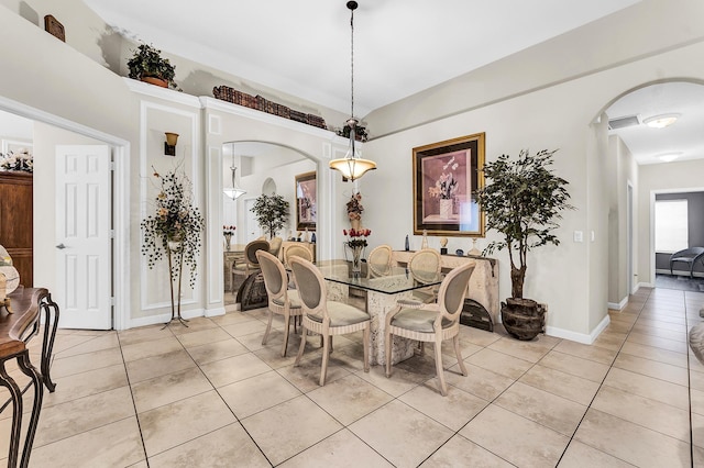 dining area with light tile patterned floors