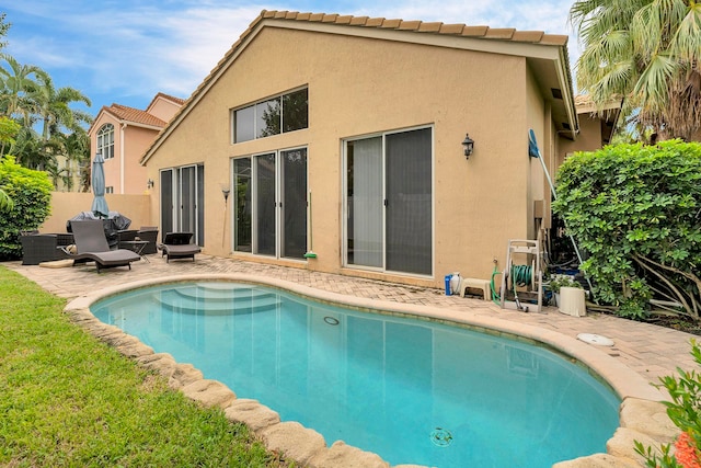 view of pool featuring a patio area