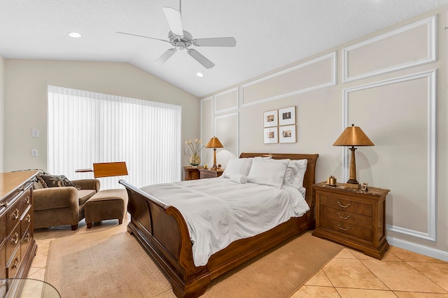 bedroom with lofted ceiling, ceiling fan, a textured ceiling, and light tile patterned flooring