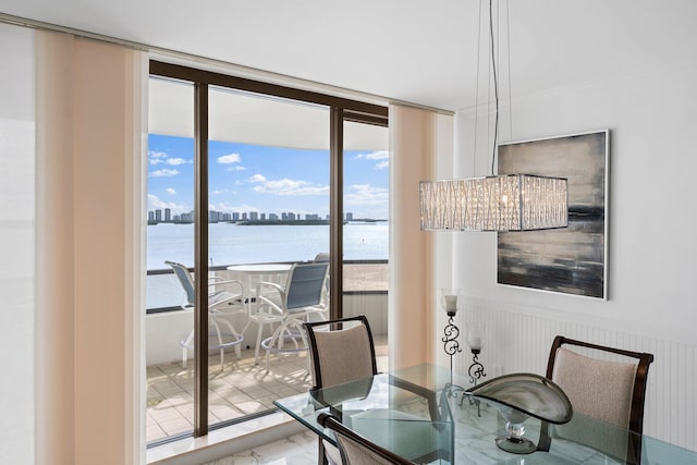 100 Lakeshore Dr Unit 457, North Palm Beach, FL 33408 - dining room featuring plenty of natural light, a view of skyline, and a water view