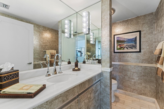 100 Lakeshore Dr Unit 457, North Palm Beach, FL 33408 - full bathroom with toilet, vanity, and tile walls