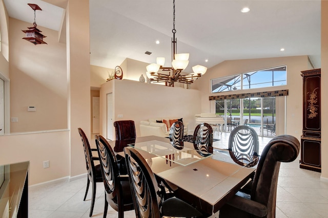 tiled dining room featuring a chandelier and high vaulted ceiling