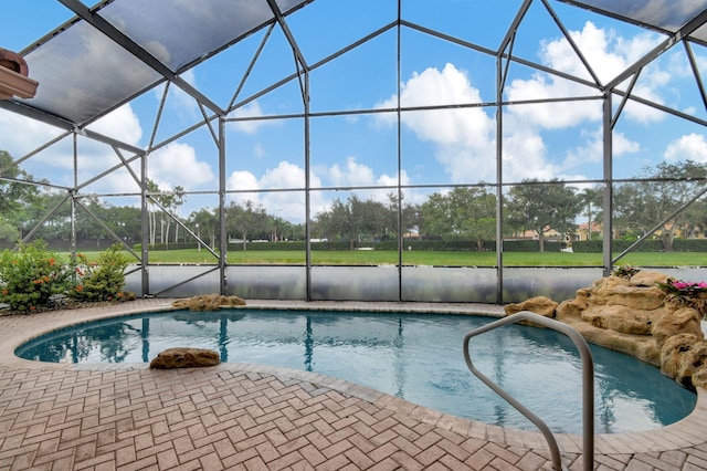 view of pool featuring a patio area and a lanai