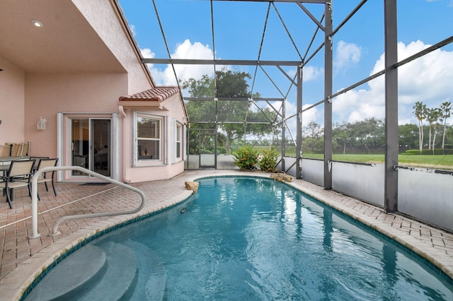 view of pool featuring a patio area and a lanai