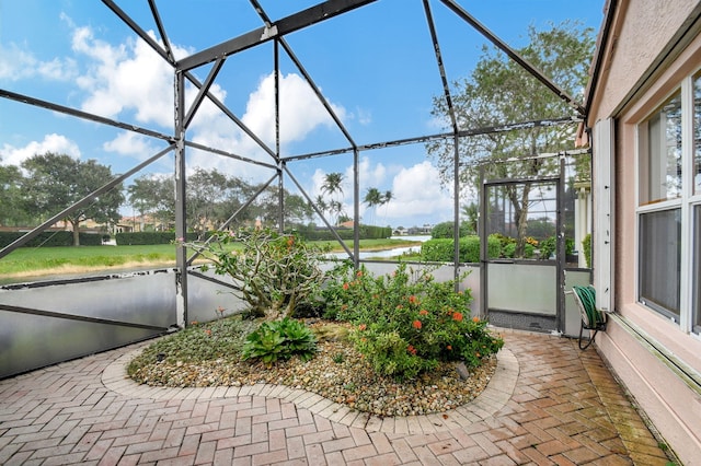 view of patio / terrace featuring a lanai