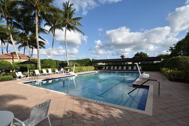 view of swimming pool with a patio