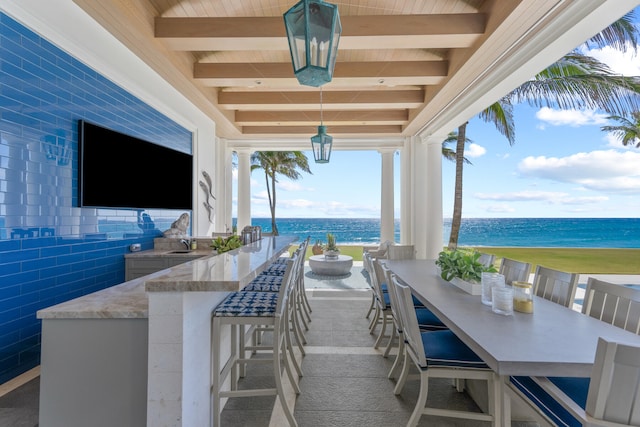 view of patio featuring an outdoor bar