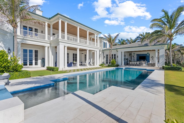 view of pool featuring french doors and a patio area