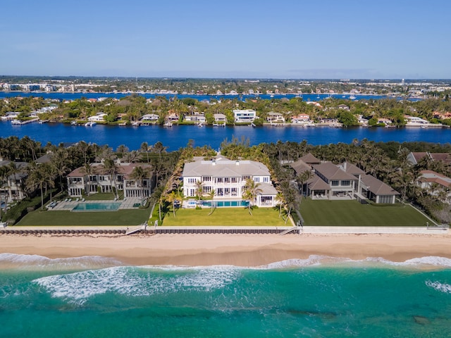 drone / aerial view featuring a view of the beach and a water view