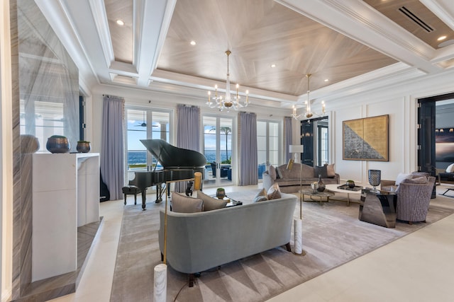 living room featuring ornamental molding, coffered ceiling, and a chandelier