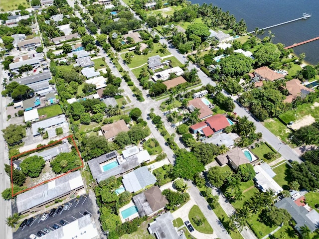 drone / aerial view featuring a water view and a residential view