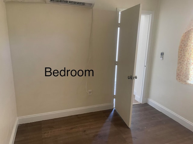 unfurnished room featuring dark wood-type flooring