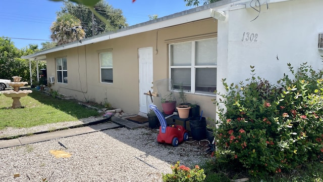 view of side of property with stucco siding