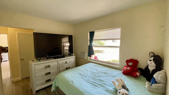 bedroom featuring wood finished floors