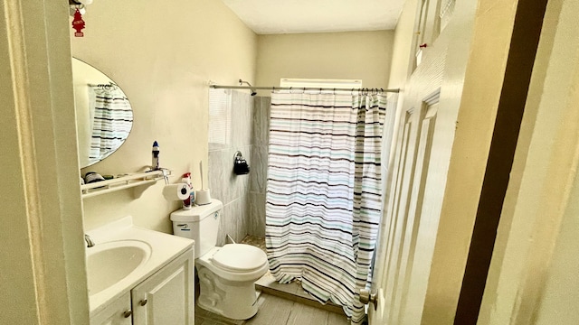 bathroom with vanity, toilet, and a shower with curtain