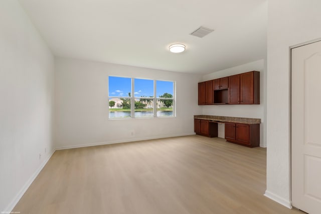 unfurnished living room with light hardwood / wood-style flooring