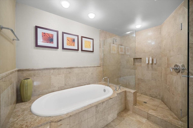 bathroom featuring shower with separate bathtub and tile patterned floors