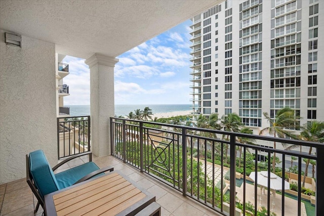 balcony featuring a water view