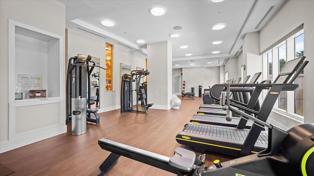 gym with hardwood / wood-style floors