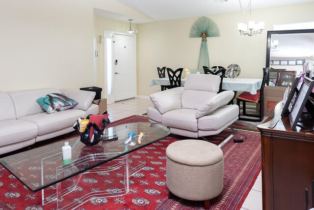 tiled living room featuring a notable chandelier