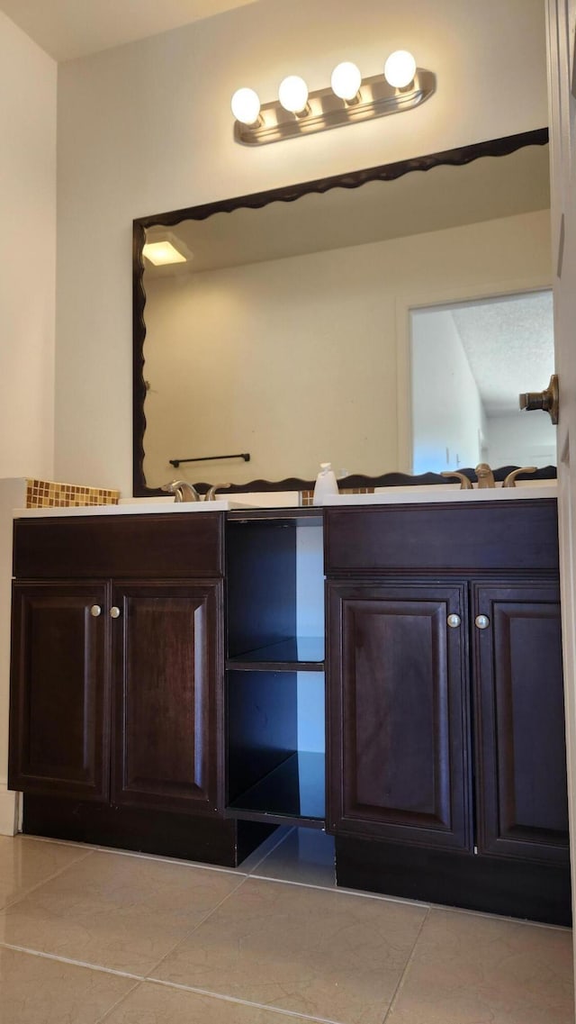 bathroom featuring tile patterned floors and vanity