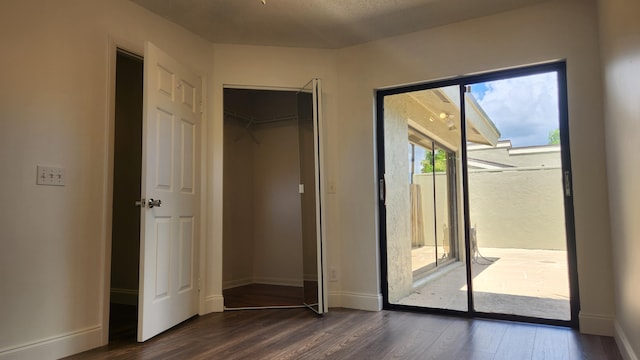 doorway with dark hardwood / wood-style floors