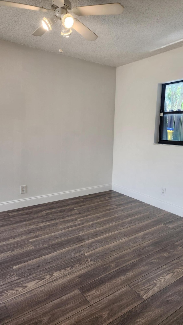 unfurnished room with ceiling fan, dark hardwood / wood-style floors, and a textured ceiling