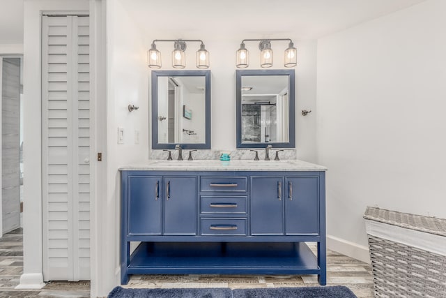 bathroom with vanity and wood-type flooring