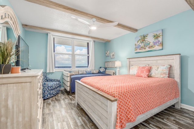 bedroom with ceiling fan and dark hardwood / wood-style floors