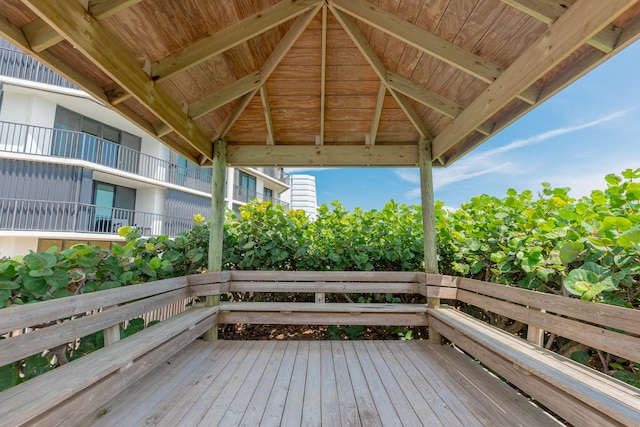 wooden terrace featuring a gazebo