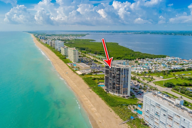 aerial view featuring a water view and a beach view